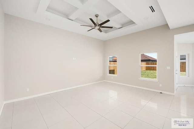 tiled empty room featuring ceiling fan and coffered ceiling