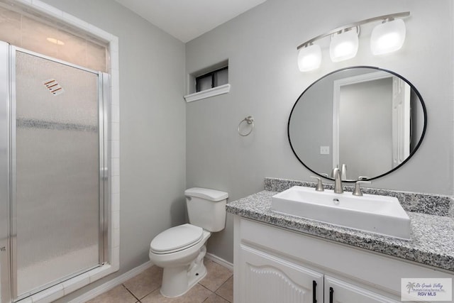 bathroom featuring a stall shower, baseboards, toilet, tile patterned flooring, and vanity