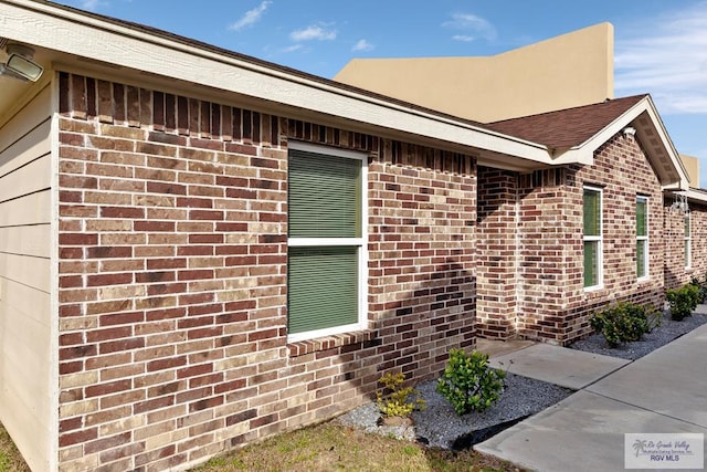 view of side of home featuring a patio area