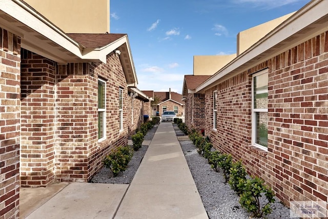 view of side of property with a patio area