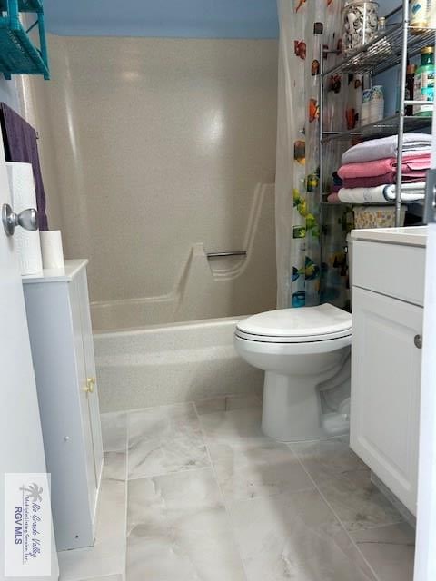 bathroom with toilet, vanity, and walk in shower