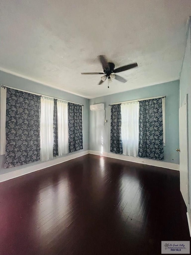 empty room featuring hardwood / wood-style floors and ceiling fan