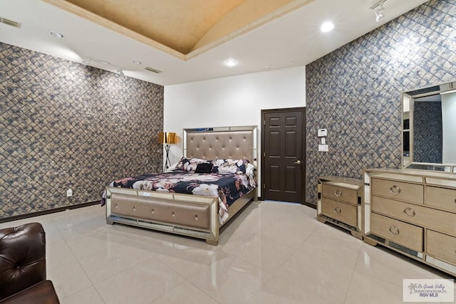 2360 Deer Run Cir, Brownsville, TX 78521 - bedroom featuring light tile patterned floors, wallpapered walls, lofted ceiling, recessed lighting, and baseboards