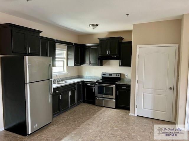 kitchen with sink and appliances with stainless steel finishes