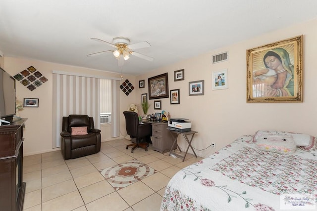 tiled bedroom featuring ceiling fan