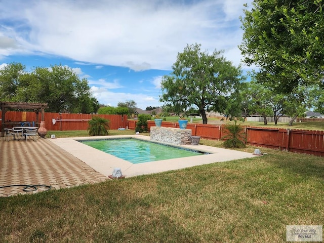 view of swimming pool featuring a lawn and a patio