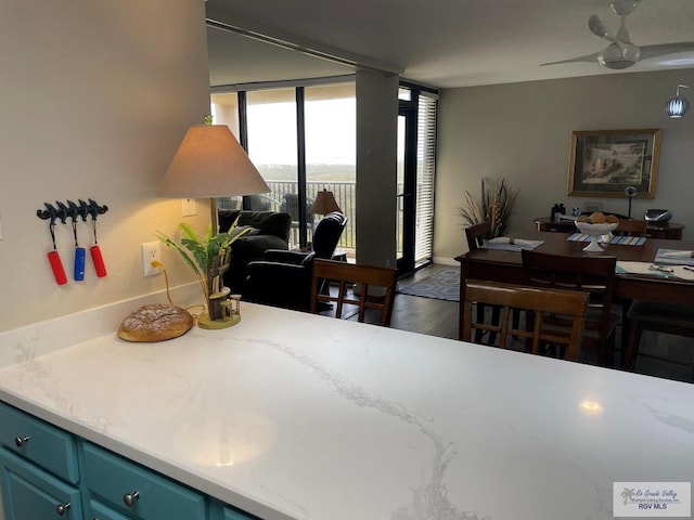110 Padre Blvd Unit 202, South Padre Island, TX 78597 - dining room with floor to ceiling windows and a ceiling fan