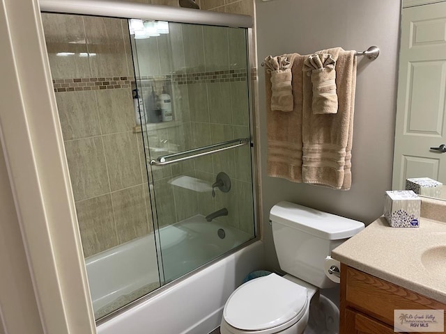 110 Padre Blvd Unit 202, South Padre Island, TX 78597 - bathroom featuring shower / bath combination with glass door, toilet, and vanity