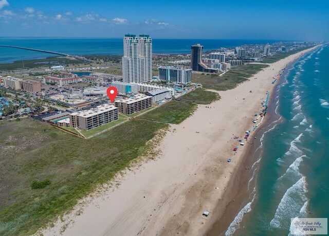 aerial view with a city view, a beach view, and a water view