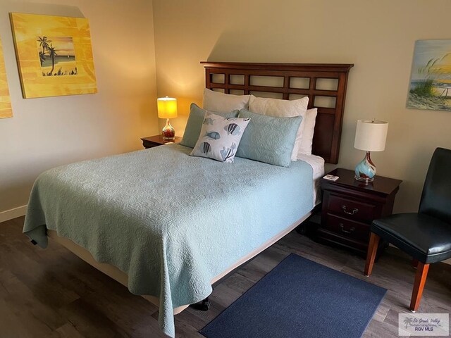 bedroom with wood finished floors