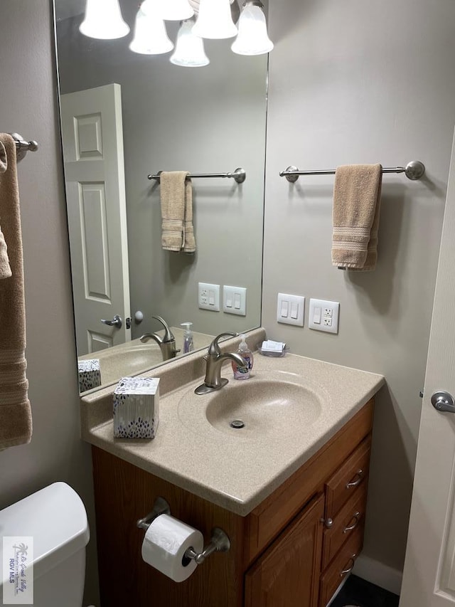 110 Padre Blvd Unit 202, South Padre Island, TX 78597 - bathroom featuring vanity and toilet