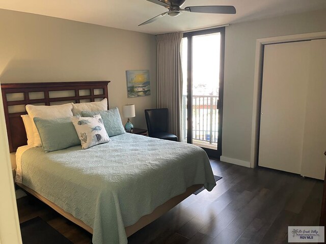 bedroom featuring access to outside, dark wood finished floors, a ceiling fan, and baseboards