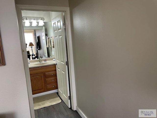 110 Padre Blvd Unit 202, South Padre Island, TX 78597 - bathroom featuring wood finished floors and vanity