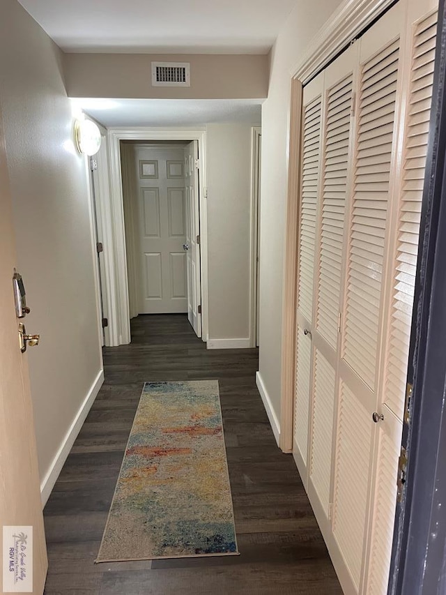 110 Padre Blvd Unit 202, South Padre Island, TX 78597 - hallway with baseboards and dark wood-style floors