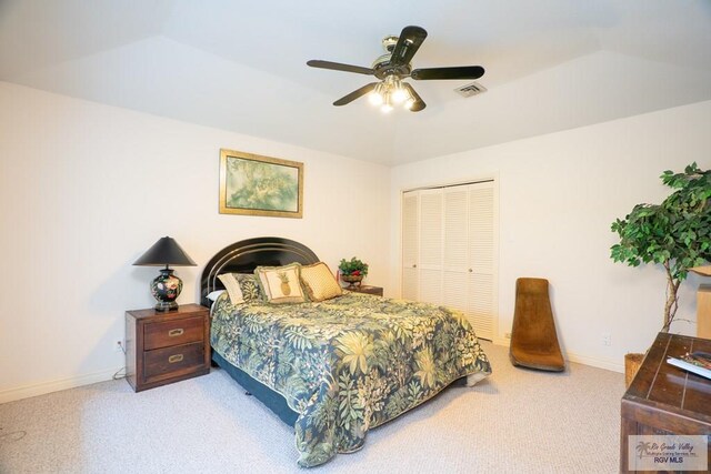 carpeted bedroom with a closet and ceiling fan