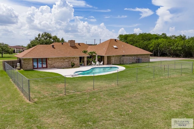 view of pool featuring a patio area and a lawn