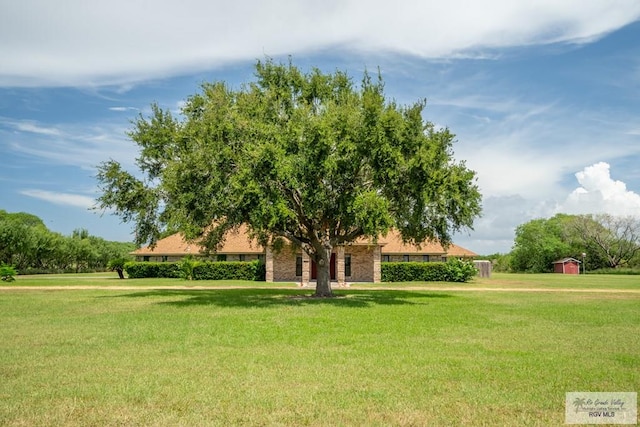 view of home's community featuring a yard