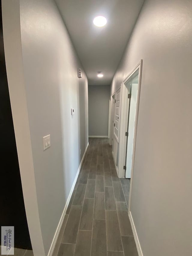 1271 Bridle Way, San Benito, TX 78586 - corridor featuring baseboards and wood tiled floors