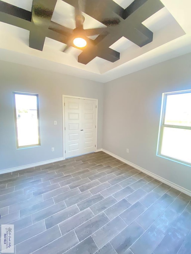 1271 Bridle Way, San Benito, TX 78586 - unfurnished bedroom with baseboards, a ceiling fan, a closet, and a raised ceiling