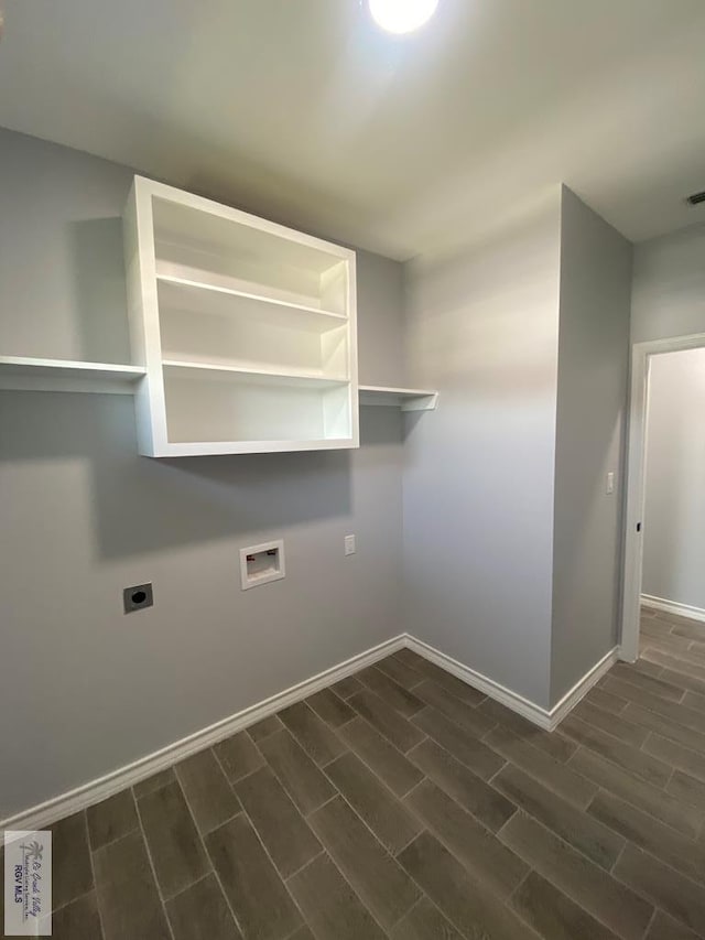 1271 Bridle Way, San Benito, TX 78586 - clothes washing area with electric dryer hookup, wood tiled floors, baseboards, and hookup for a washing machine