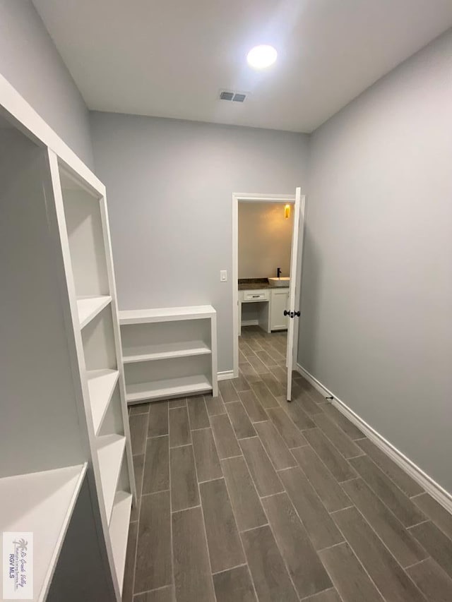 1271 Bridle Way, San Benito, TX 78586 - hallway with dark wood-style flooring, baseboards, and recessed lighting