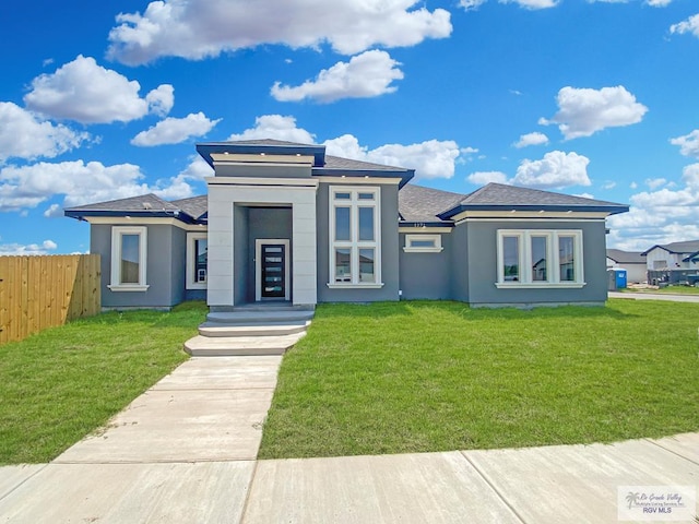 1271 Bridle Way, San Benito, TX 78586 - prairie-style house featuring stucco siding and a shingled roof