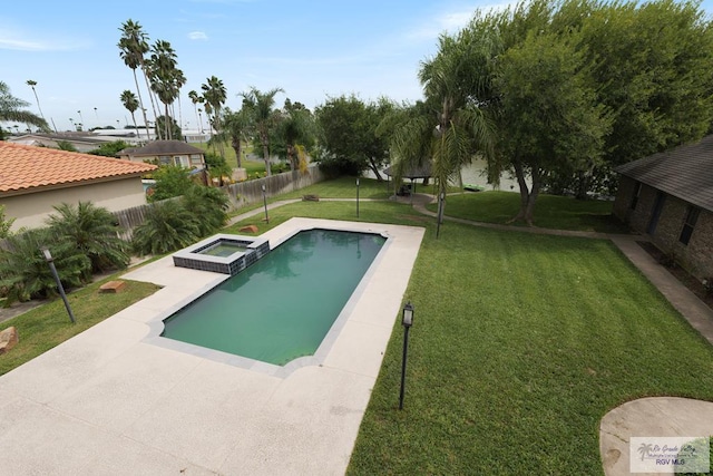 view of swimming pool featuring an in ground hot tub, a yard, and a patio area