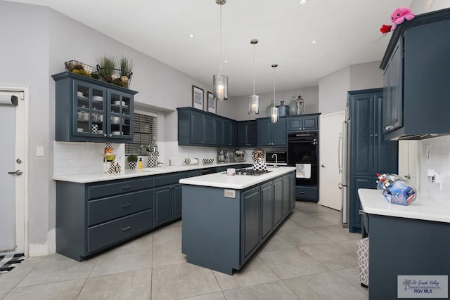 kitchen featuring a center island, hanging light fixtures, tasteful backsplash, black double oven, and light tile patterned floors