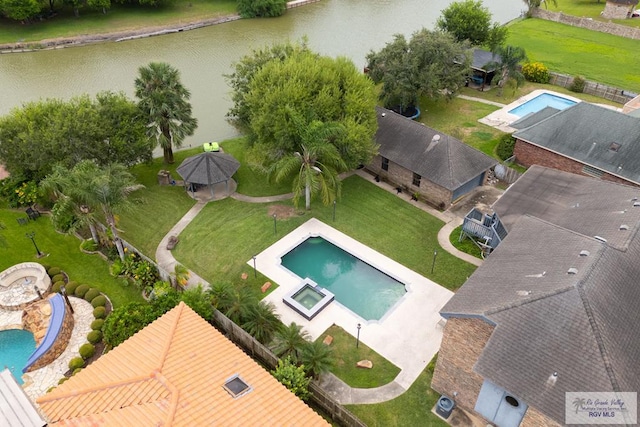 birds eye view of property featuring a water view