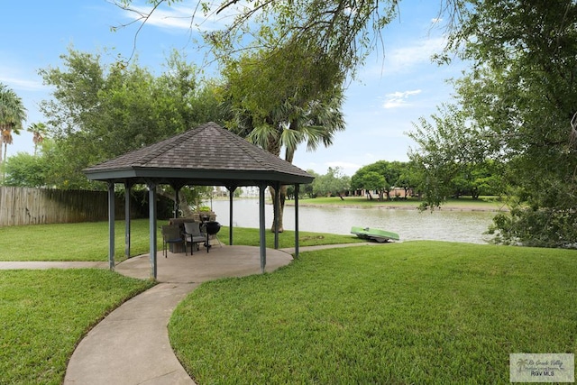 view of yard featuring a gazebo and a water view