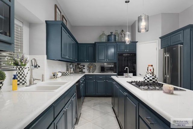 kitchen with pendant lighting, sink, backsplash, and black appliances