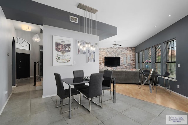 dining space with wood-type flooring and ceiling fan