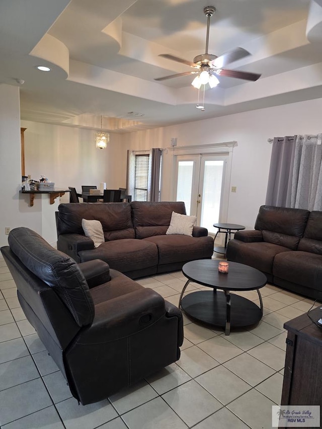 7301 Alabama Pine St, Brownsville, TX 78535 - living room featuring a raised ceiling, light tile patterned floors, a ceiling fan, french doors, and recessed lighting