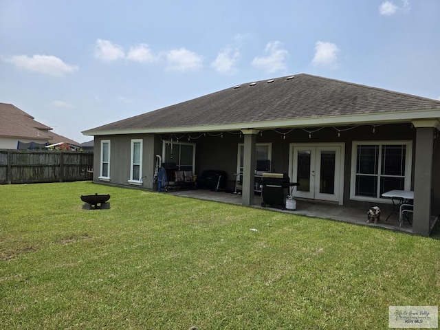7301 Alabama Pine St, Brownsville, TX 78535 - rear view of house with a shingled roof, a patio, french doors, and stucco siding