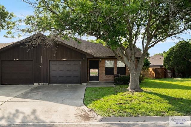 6246 Camelot Dr, Harlingen, TX 78550 - ranch-style house with driveway, a garage, a shingled roof, and brick siding
