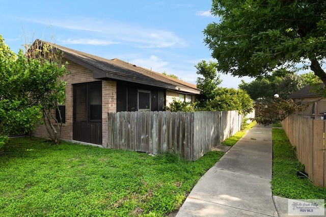 6246 Camelot Dr, Harlingen, TX 78550 - view of side of home featuring brick siding