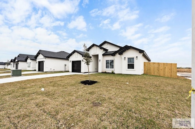 view of front of property with a garage and a front yard