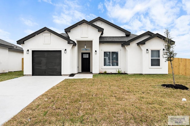 view of front of home with a garage and a front yard