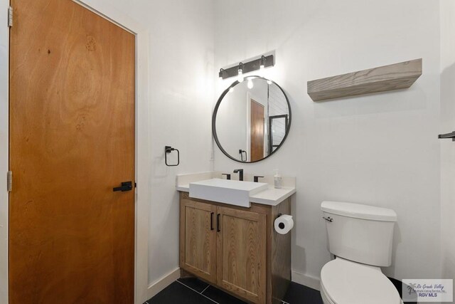 112 W Sunny Isle Dr, South Padre Island, TX 78597 - bathroom with vanity and tile patterned flooring