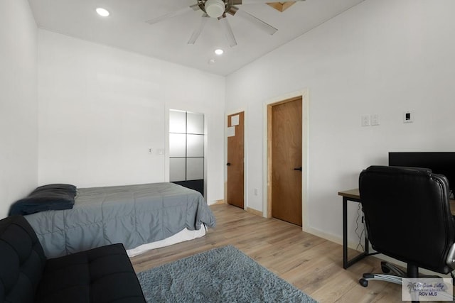 bedroom featuring ceiling fan and light wood-type flooring