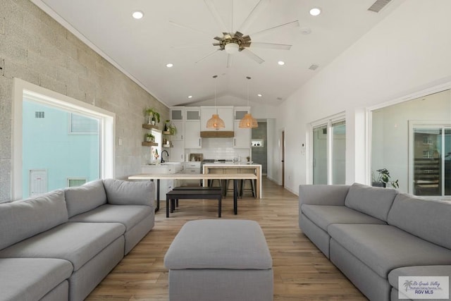 112 W Sunny Isle Dr, South Padre Island, TX 78597 - living area featuring recessed lighting, ceiling fan, lofted ceiling, and light wood-style flooring