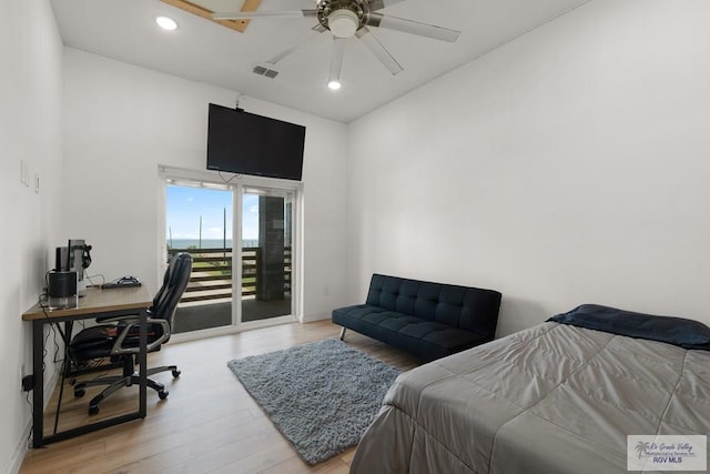 bedroom featuring access to outside, ceiling fan, and light hardwood / wood-style floors