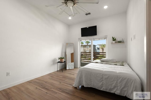 112 W Sunny Isle Dr, South Padre Island, TX 78597 - bedroom featuring wood finished floors, recessed lighting, and a ceiling fan