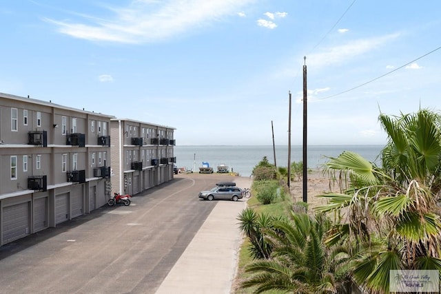 surrounding community featuring a water view