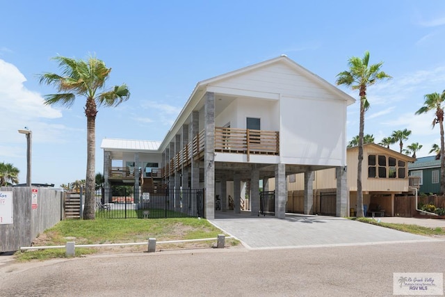 112 W Sunny Isle Dr, South Padre Island, TX 78597 - view of property featuring a carport and driveway