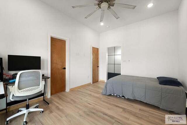 112 W Sunny Isle Dr, South Padre Island, TX 78597 - bedroom with wood finished floors, recessed lighting, a towering ceiling, and ceiling fan