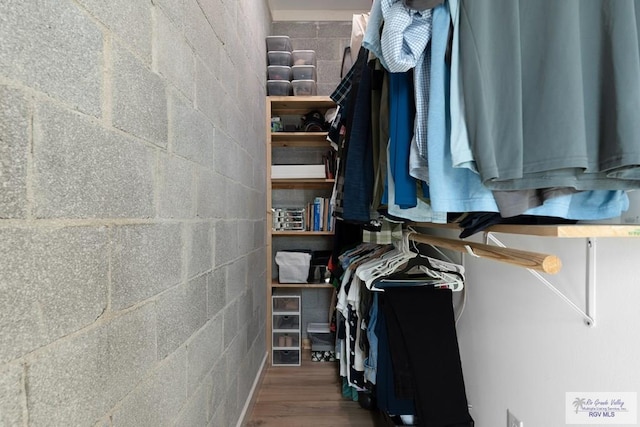 walk in closet featuring hardwood / wood-style floors