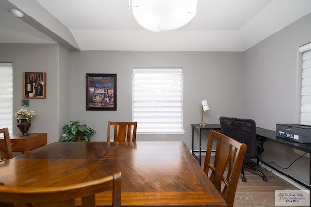 dining space with wood finished floors