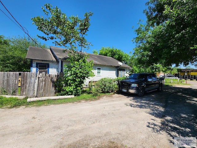 view of home's exterior featuring fence