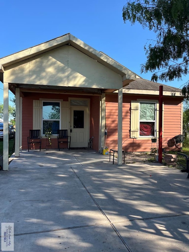 back of house with covered porch